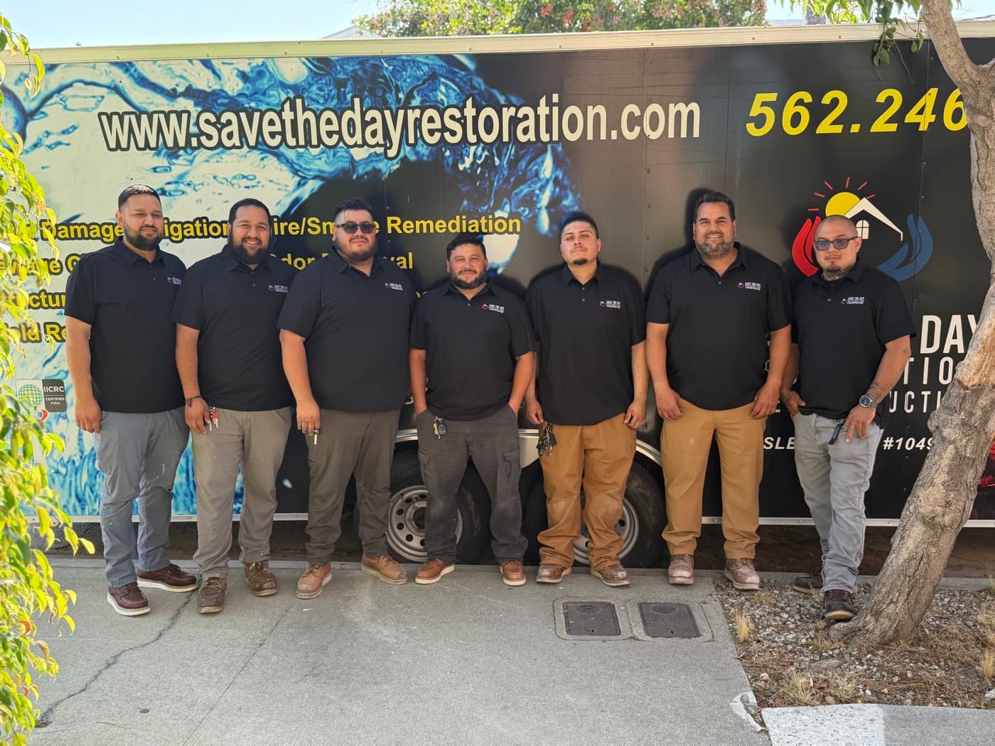 The Save The Day team in front of a branded restoration vehicle in Los Angeles County